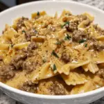 creamy Parmesan garlic beef bowtie pasta with tender beef and flavorful sauce.